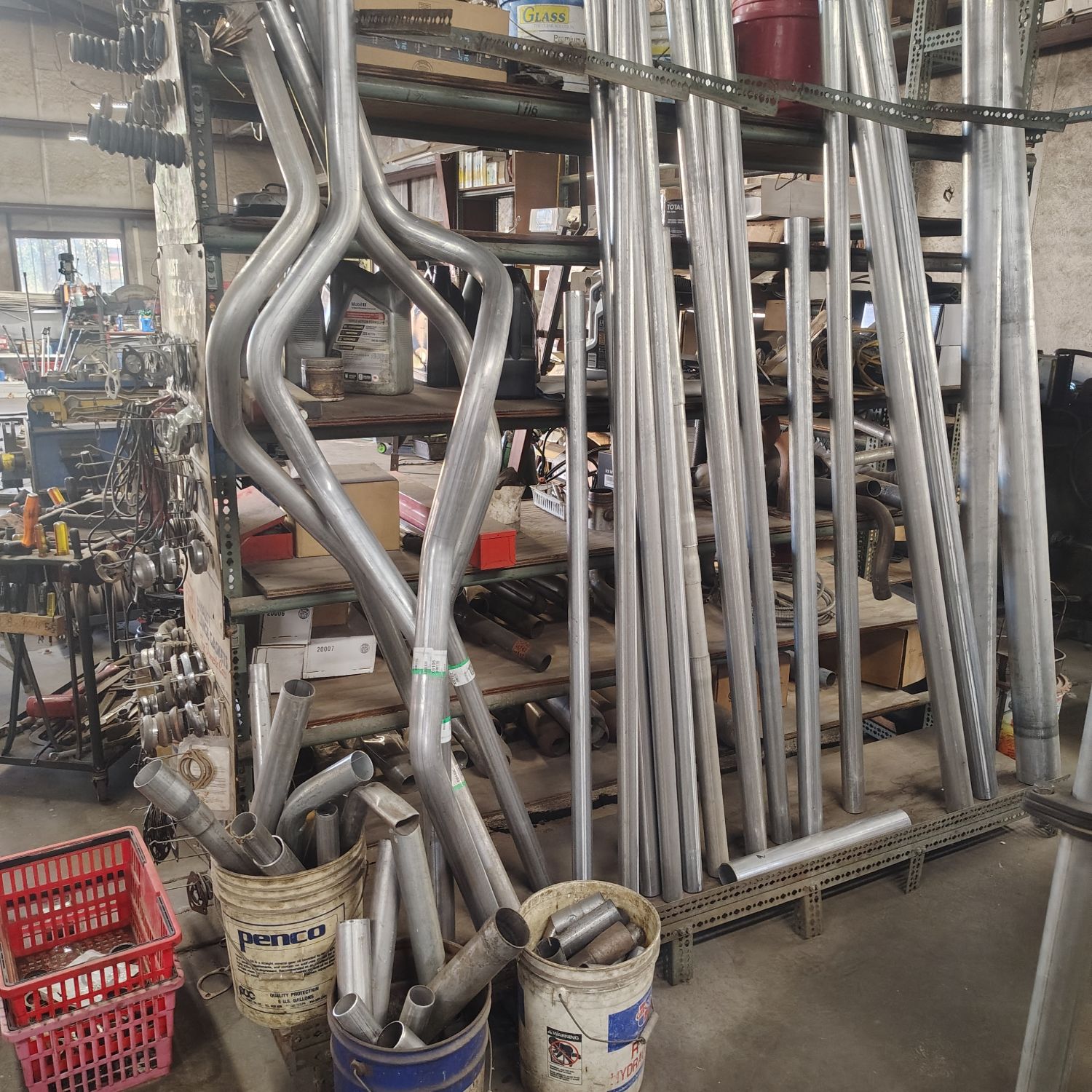 Racks of exhaust pipe at the Athens, TX muffler and exhaust shop